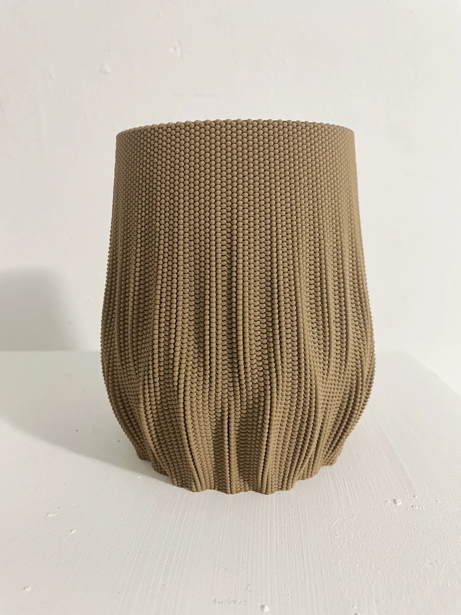 Parametric 3D printed vase design inspired by woven textiles, PLA and bronze material, computational design object.
