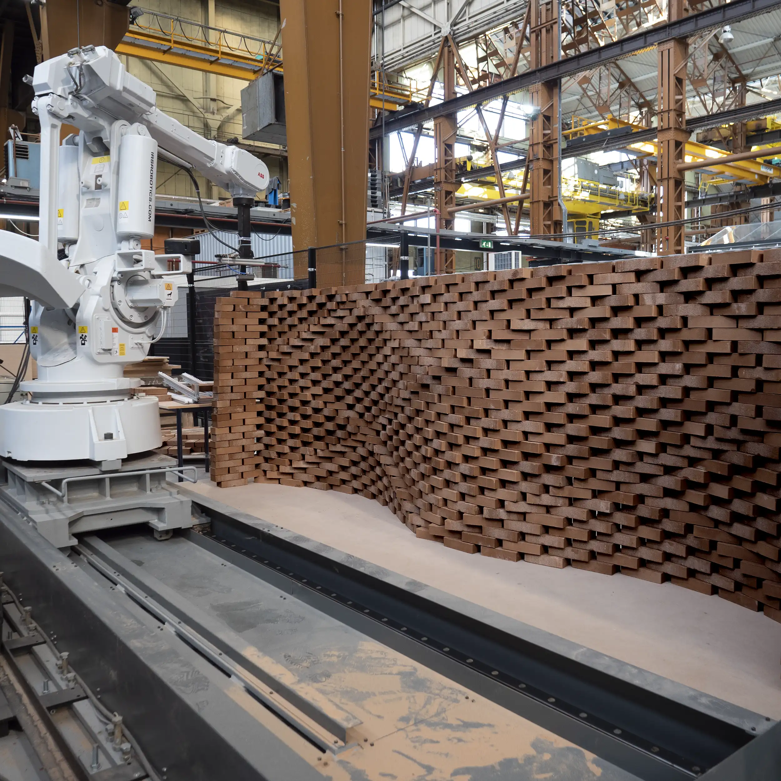Robotic fabrication of a parametric brick wall prototype, built using a robot arm controlled by a computational design algorithm.